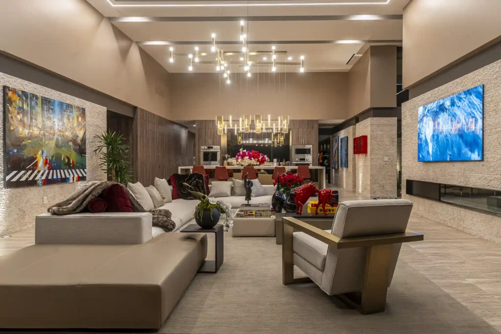 Former boxing champ lists luxurious Las Vegas mansion for $20 million, boasting stunning views, lavish amenities, and modern chic interiors.