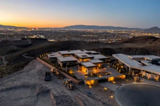 Former boxing champ lists luxurious Las Vegas mansion for $20 million, boasting stunning views, lavish amenities, and modern chic interiors.