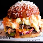 Gordon Ramsay's latest burger creation receives criticism for its messy appearance, with customers questioning the practicality of eating it and the price tag. However, some fans still find it delicious and worth trying.