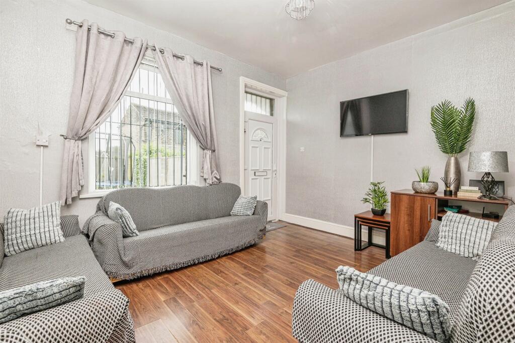 Bradford house listed for £100,000 ridiculed online for having bars on windows and doors. Despite a bright interior, social media users compare it to a 'prison.'