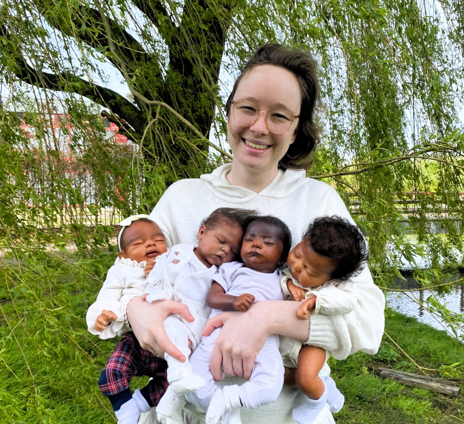 Margriet Shein creates lifelike reborn dolls after losing two pregnancies, facing online trolls but helping others with anxiety and dementia through her intricate, realistic art.