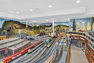 Looking for a lavish retreat? This £2.6m mansion in Northbrook, Illinois offers six bedrooms, eight bathrooms, and a surprising feature: a sprawling model train set in the basement. With over 20,890 sq ft of space, including a gym, sauna, and playroom, it's a dream home for train enthusiasts.