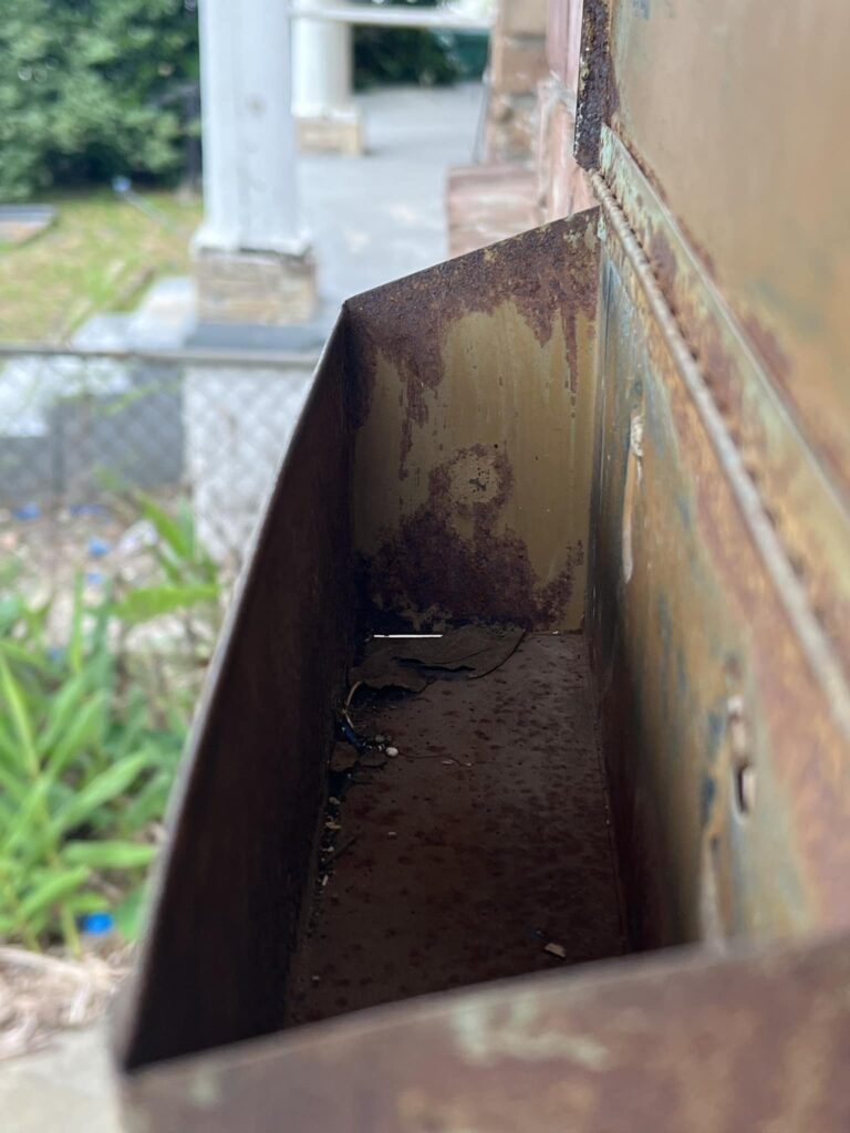 A homeowner in New Orleans discovers Ozzy Osbourne's likeness in their rusty mailbox, sparking awe and comparisons to the rock legend.