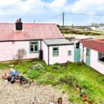 Own a detached bungalow in Britain's only desert, Dungeness, with stunning views and quirky charm. Experience isolation and atmosphere for £875k.