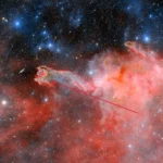 A striking celestial sight: astronomers capture images of a ghostly 'hand' stretching through space, 1,300 light years away in the constellation 'Puppis'. This cometary globule, named 'God's Hand', is a unique formation of dust and gas, sparking debate among researchers about its origins.