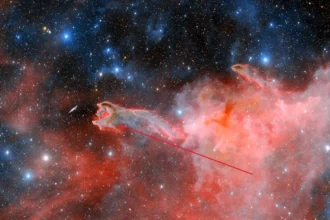 A striking celestial sight: astronomers capture images of a ghostly 'hand' stretching through space, 1,300 light years away in the constellation 'Puppis'. This cometary globule, named 'God's Hand', is a unique formation of dust and gas, sparking debate among researchers about its origins.