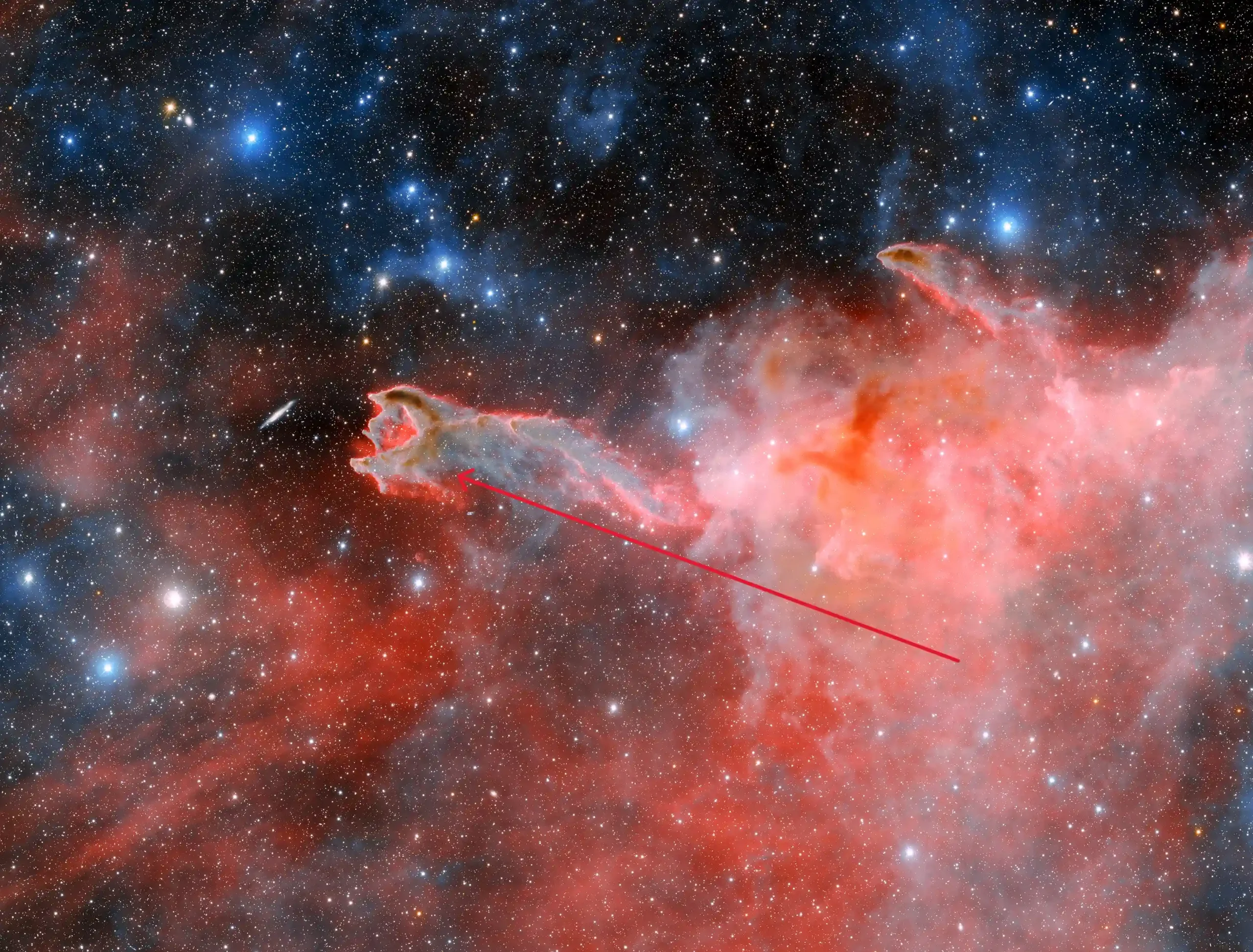 A striking celestial sight: astronomers capture images of a ghostly 'hand' stretching through space, 1,300 light years away in the constellation 'Puppis'. This cometary globule, named 'God's Hand', is a unique formation of dust and gas, sparking debate among researchers about its origins.