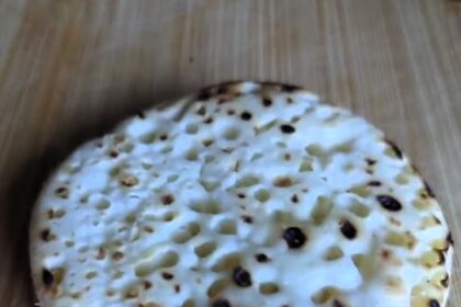 A South London woman's viral crumpet hack involves stuffing it with chocolate, cinnamon, sugar, and butter, then air frying it for a gooey treat.