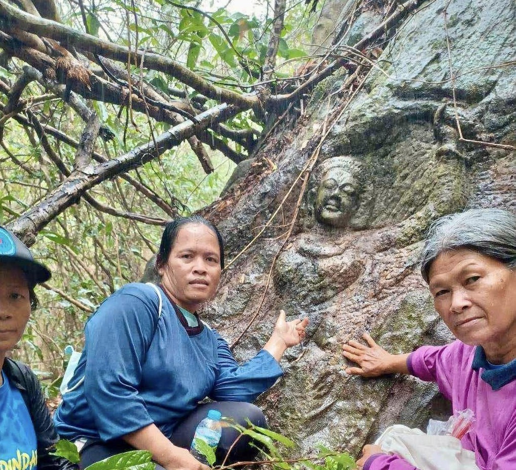 ancient carving of Buddha's mother found in a Thai forest, sparking speculation about its significance and age.