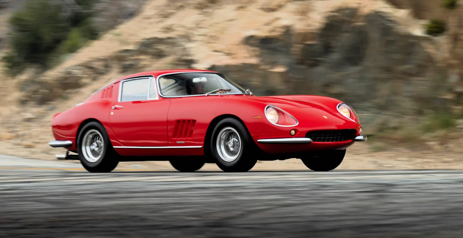 Rare Ferrari, one of 16 made, hits auction block at £3.5 million. Classic red 275 GTB/4 boasts top speed of 167mph, historic provenance included.