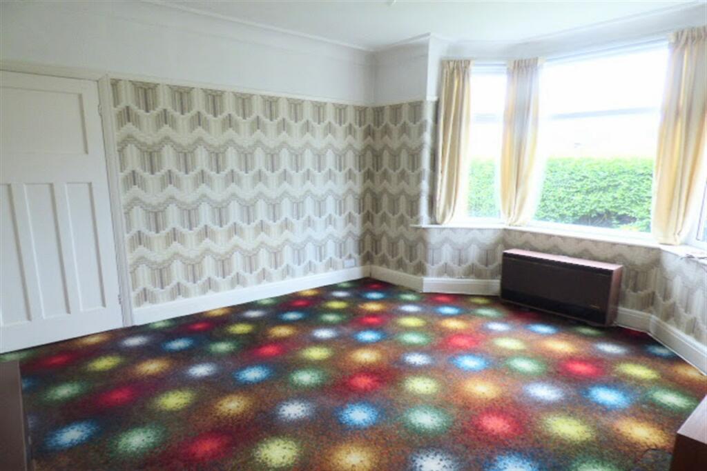 A three-bed semi-detached house in Weston, Runcorn, with dated, patterned carpets throughout, is on the market for £220,000. Listed by Edward Grounds Estate Agents.