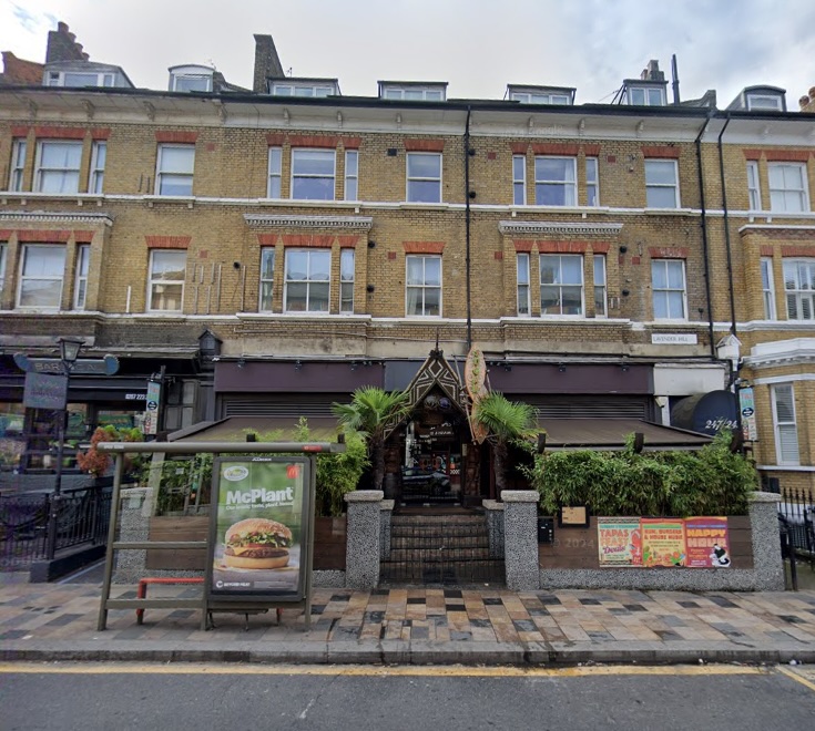 The Sugar Cane Bar, a Tiki-themed nightclub in Clapham, south London, is for sale for £100,000. Established in 2007, it features a bamboo bar, Tiki hut booths, unique cocktails, and share platters, with a 2am weekend license and two floors for the new owner to utilize.