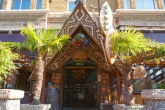 The Sugar Cane Bar, a Tiki-themed nightclub in Clapham, south London, is for sale for £100,000. Established in 2007, it features a bamboo bar, Tiki hut booths, unique cocktails, and share platters, with a 2am weekend license and two floors for the new owner to utilize.