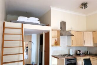 Studio flat in Stepney Green, east London, offers modern amenities but requires tenants to buy new furniture, raising the monthly cost.