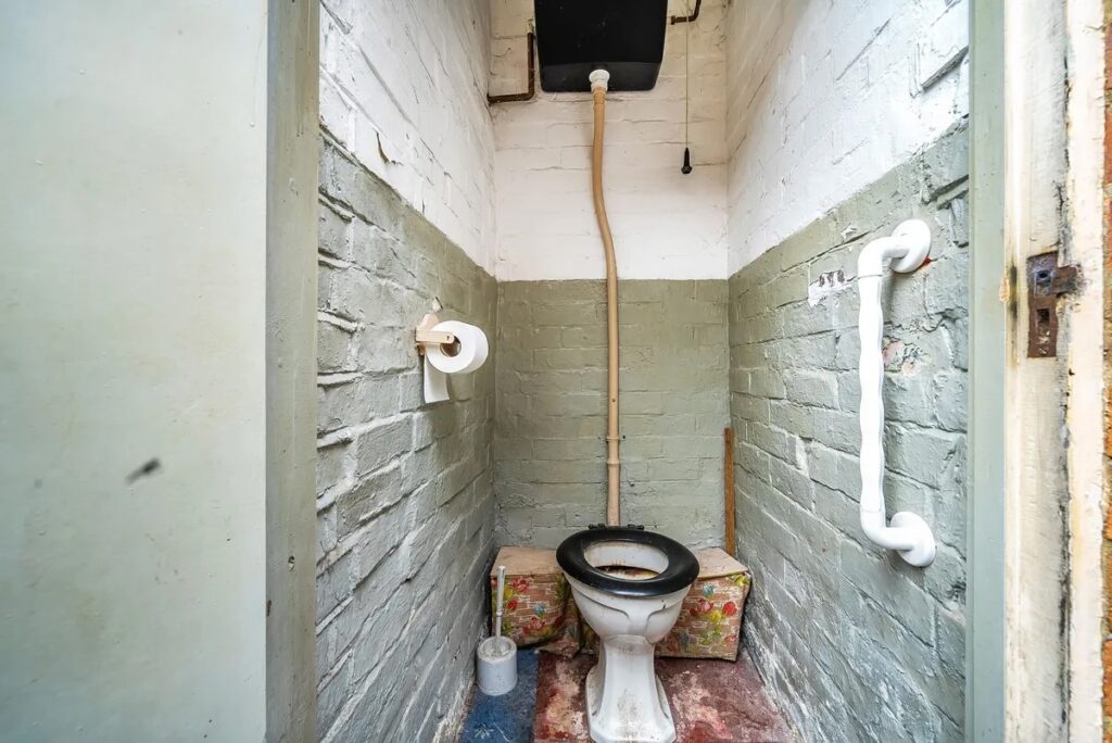 Victorian terraced house listed at £220,000 comes with a secret outdoor loo, requiring TLC but offering potential for renovation.