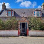 An unassuming cottage in Ardersier, Inverness, is up for auction at £75,000. While the exterior appears standard, the inside is a mess with sunken ceilings, graffiti, and rubbish-filled rooms. Ideal for a DIY enthusiast.