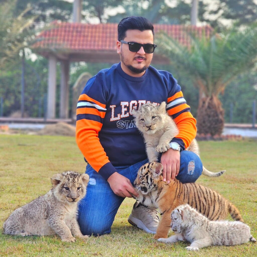 Influencer Nouman Hassan, who keeps wild animals as pets, was slapped in the face by his cheetah in a video that sparked outrage online, highlighting the risks of domesticating wildlife.