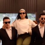 Influencer Ingrid Ohara puzzled gym-goers by working out with two besuited bodyguards. The viral video, watched over 4 million times, shows her intense workout with comedic protection.