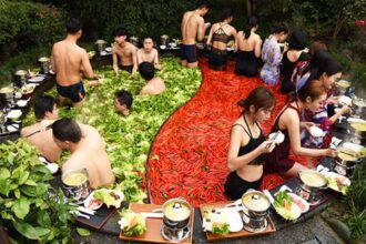 A hotel in Hangzhou, China, offers a unique spa experience where guests stew in a human hot pot with vegetables like chillis, lemons, corn, and apples. This peculiar spa aims to promote a healthy lifestyle and costs around £21 to £28.