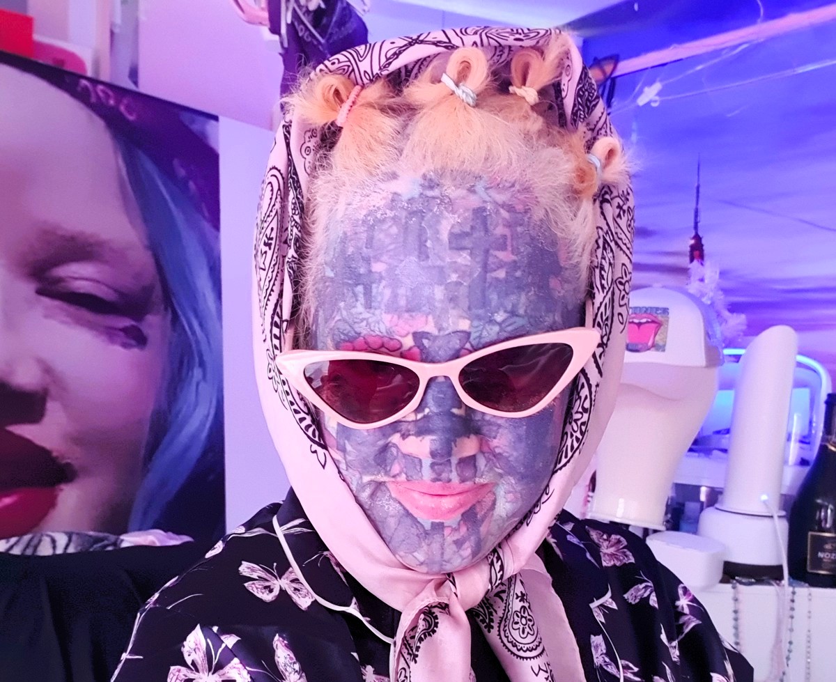 Britain's most tattooed mum, Melissa Sloan, avoids beaches during the UK heatwave as her extensive body art scares children. Discover her story of acceptance and resilience.