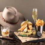 Indulge in the £1,400 1876 Burger Experience with A5 Wagyu, caviar, and more. Includes champagne, bourbon, a 1964 cigar, and a custom cowboy hat at Burgers and Bourbon, Utah.