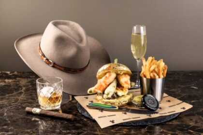Indulge in the £1,400 1876 Burger Experience with A5 Wagyu, caviar, and more. Includes champagne, bourbon, a 1964 cigar, and a custom cowboy hat at Burgers and Bourbon, Utah.