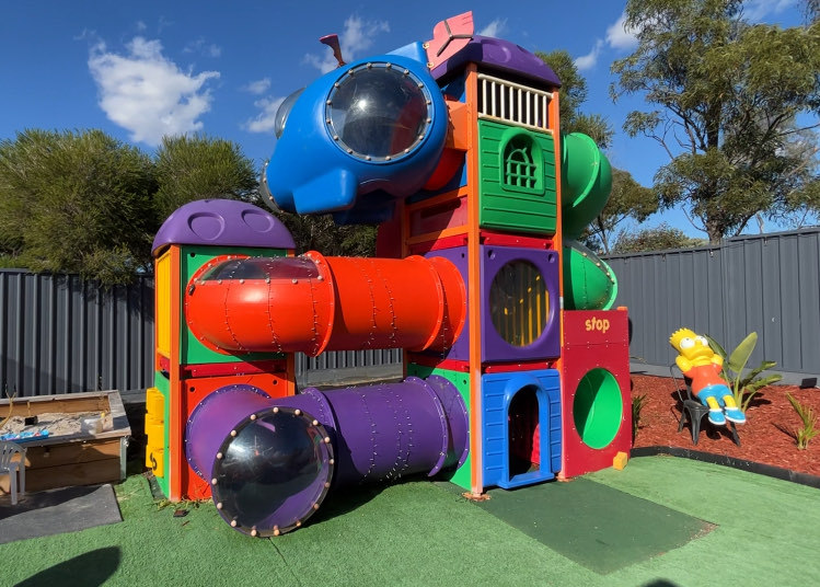 A couple in Australia built a McDonald's playground in their garden for their kids after finding it on eBay for £2,600. The fun-themed yard includes a playhouse, skate park, and more.