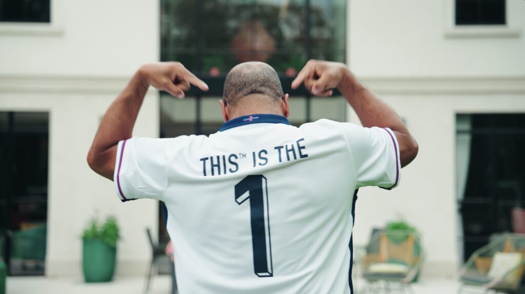 John Barnes teams up with plant-based company THIS for new Euro 2024 anthem "THIS Is The One," celebrating football, BBQs, and sustainability. Declan Rice tipped to rap too!