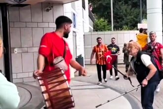 A German granny silences a Turkish fan's drum with her walking sticks, protesting the noise before Turkey's 3-1 win against Georgia in Dortmund, leaving fans in stitches.
