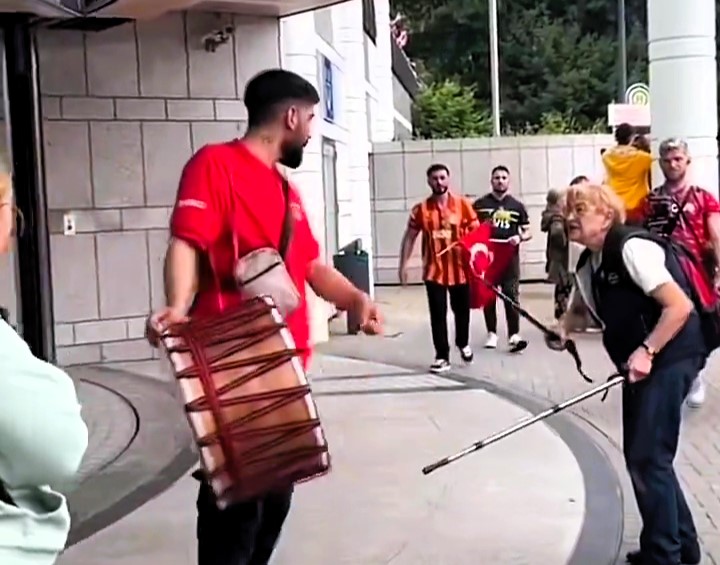 A German granny silences a Turkish fan's drum with her walking sticks, protesting the noise before Turkey's 3-1 win against Georgia in Dortmund, leaving fans in stitches.