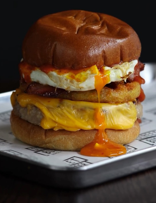 Gordon Ramsay faces backlash for his new £9 breakfast burger with a runny fried egg at Street Burger restaurants. Some love it, others call it "disgusting." Try it yourself!