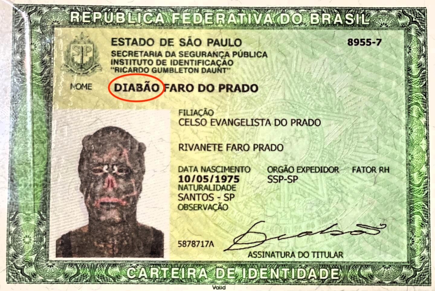 Body modification enthusiast Michel Faro do Prado, known as "Human Satan," receives a new passport with his Satanic name and altered image, showcasing his extreme transformations.
