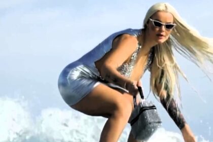 TikTok star Karolina Agata Sankiewicz ridiculed for surfing in stilettos and dresses, but her viral videos prove it's real. Watch the 'Barbie Dubai Surfer' ride the waves in style!
