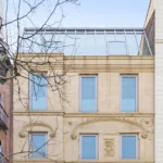 A stunning New York townhouse on the Upper East Side is listed for just under $18 million. This five-story home features a private elevator, a 23-foot indoor waterfall, six bedrooms, six bathrooms, and a rooftop garden.