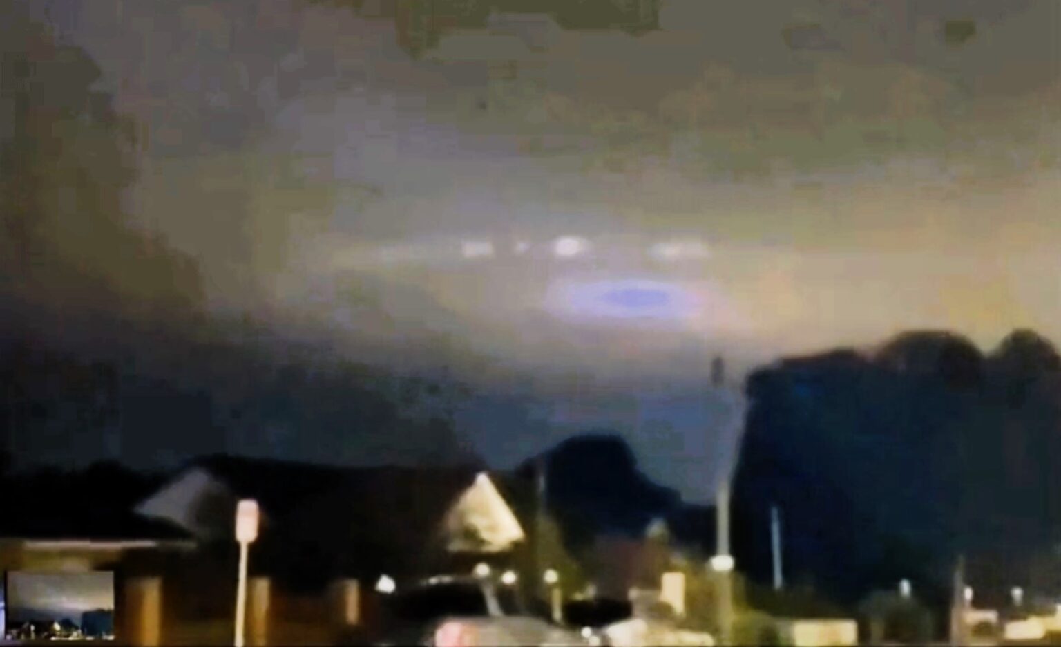 A suspected alien mothership with multiple lights was spotted in Hungary's night sky, sparking debates. Mexican ufologist Jaime Maussan claims it as proof of extraterrestrial life.