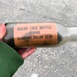 A 63-year-old message in a bottle, launched in 1961 to track ocean currents, has washed up on Cape Cod. This relic from the past offers a glimpse into early research methods.