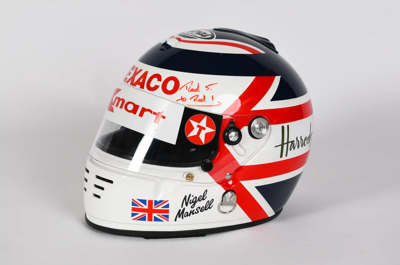 Nigel Mansell's F1 memorabilia auction fetched £55,000, far less than the expected £117,000. Highlights included a signed helmet and a rare photo of four F1 champions.
