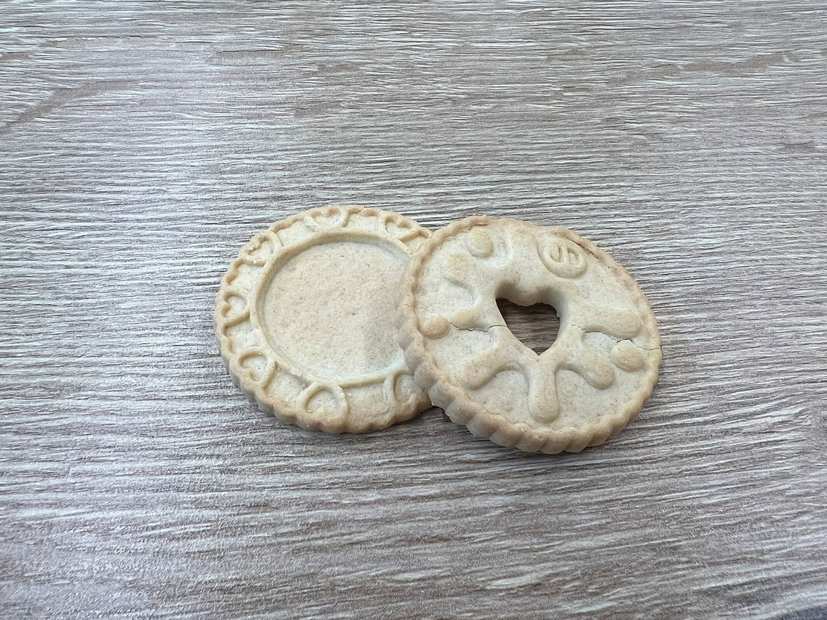 A British biscuit lover found a Jammie Dodger with no jam, sparking social media hilarity. The company apologized, promising tastier, fruitier jam in future batches.