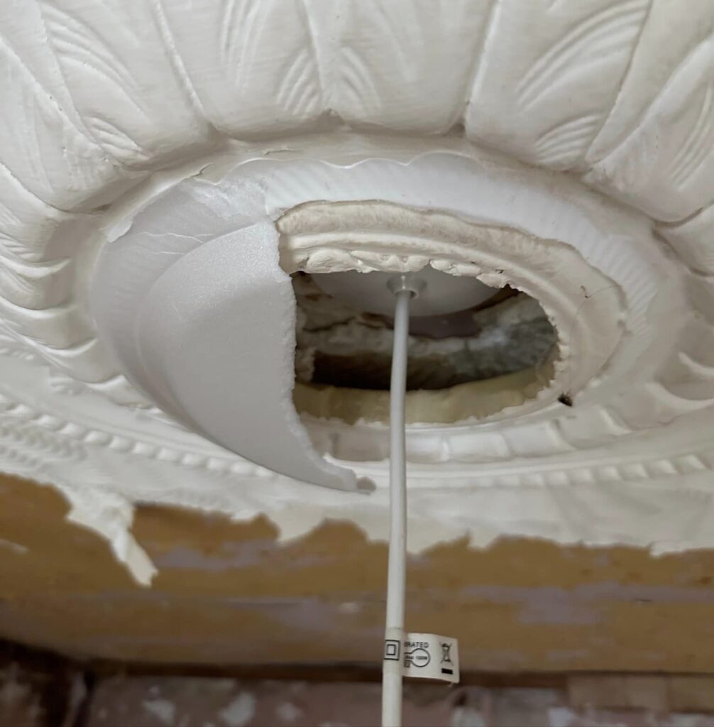 A woman helping renovate a home discovered a tenant had used a polystyrene plate as a light fixture. The DIY discovery left her and her mother in stitches.