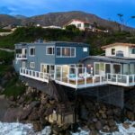 A Malibu mansion from Elvis's 1968 film 'Live a Little, Love a Little' is for sale at $8 million. This 2,800 sq ft beachfront home offers stunning views and elegant living spaces.
