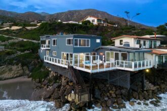 A Malibu mansion from Elvis's 1968 film 'Live a Little, Love a Little' is for sale at $8 million. This 2,800 sq ft beachfront home offers stunning views and elegant living spaces.