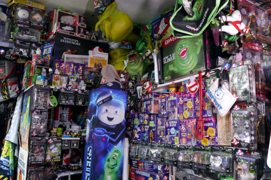 Darren McQuade, a Ghostbusters superfan, holds a world record with his collection of 2,012 memorabilia items, worth £100,000, featuring rare and unique pieces from the franchise.