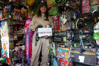 Darren McQuade, a Ghostbusters superfan, holds a world record with his collection of 2,012 memorabilia items, worth £100,000, featuring rare and unique pieces from the franchise.