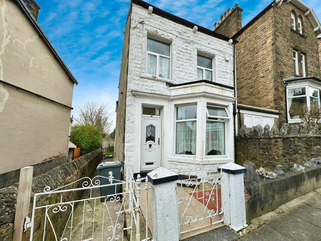 Quirky 3-bed house in Lancaster on sale for £275,000 features a shower in the kitchen. Spread over four floors with a cellar and large garden, this unique home is a renovation gem.