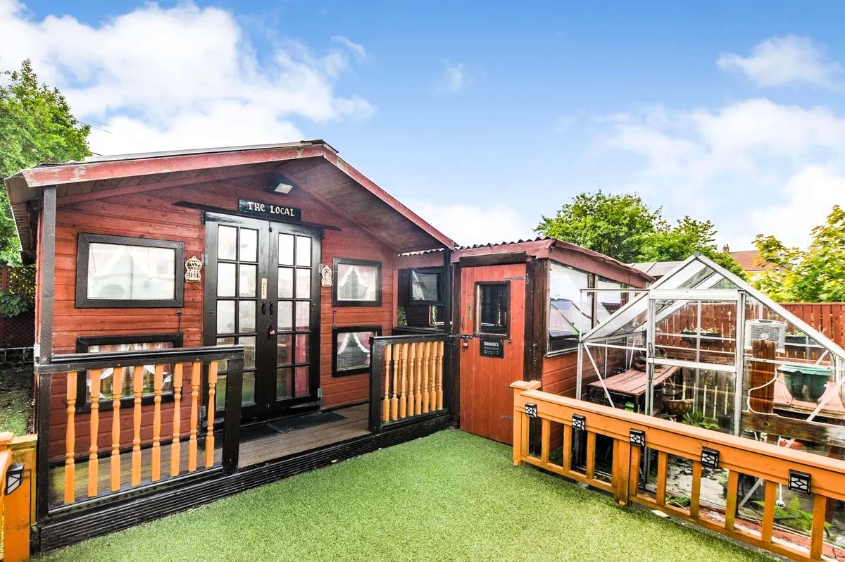 A three-bedroom semi-detached house in Kilwinning, Scotland, featuring indoor and outdoor home-bar spaces, hits the market for £89,000. Perfect for hosting and enjoying summer fun!