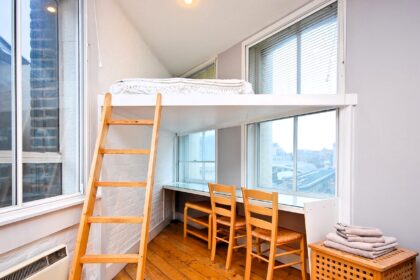 A WFH studio flat in Farringdon, East London, features a unique triangle-shaped bed for £1,500/month. Includes kitchenette, workspace, and bathroom. No pets, garden, or parking.