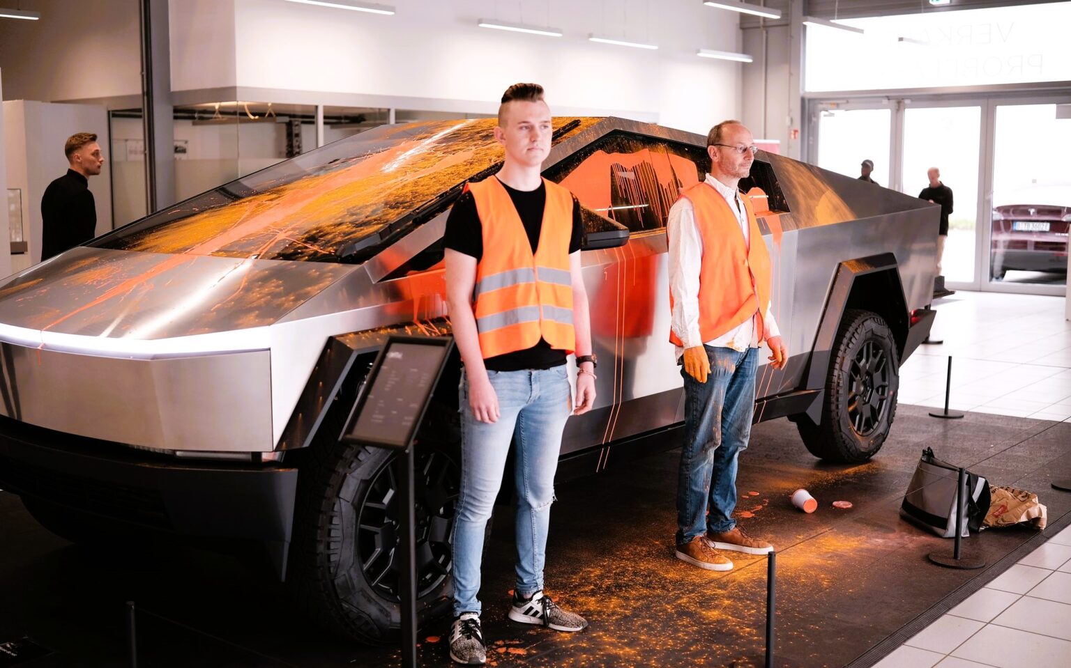 Climate activists from the Last Generation Group doused a Tesla Cybertruck in orange paint, protesting its environmental impact. The viral incident occurred in Hamburg, Germany.