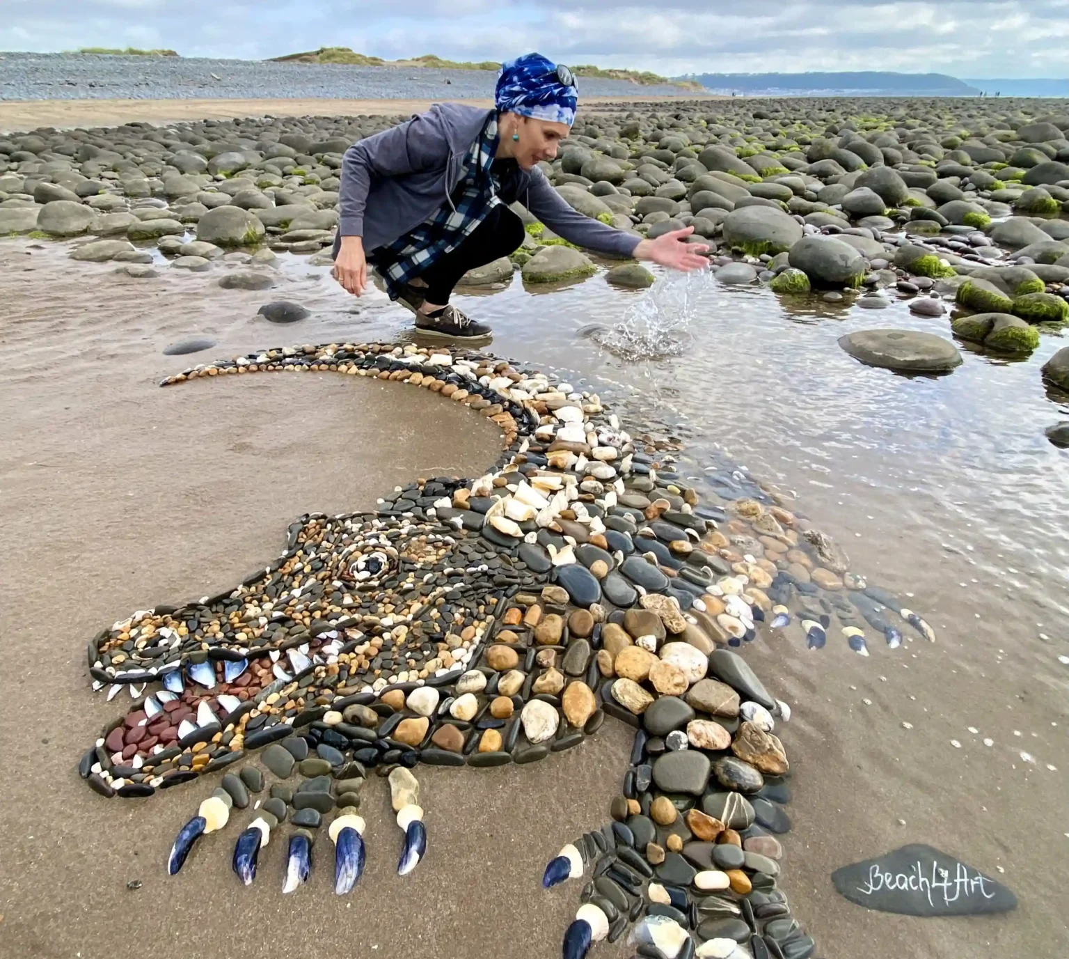 A five-foot-long alligator mosaic made from pebbles and shells by Leva and Dzindars Slare amazed beachgoers at Sandymere beach, Westward Ho!, Devon. Created in just five hours.