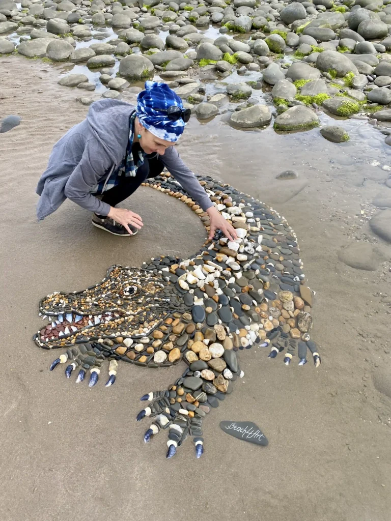 A five-foot-long alligator mosaic made from pebbles and shells by Leva and Dzindars Slare amazed beachgoers at Sandymere beach, Westward Ho!, Devon. Created in just five hours.