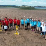 Britain's most unusual cricket match played on the River Exe estuary at low tide saw Exmouth RNLI beat Exmouth Freemasons by three runs. The unique event may become annual.